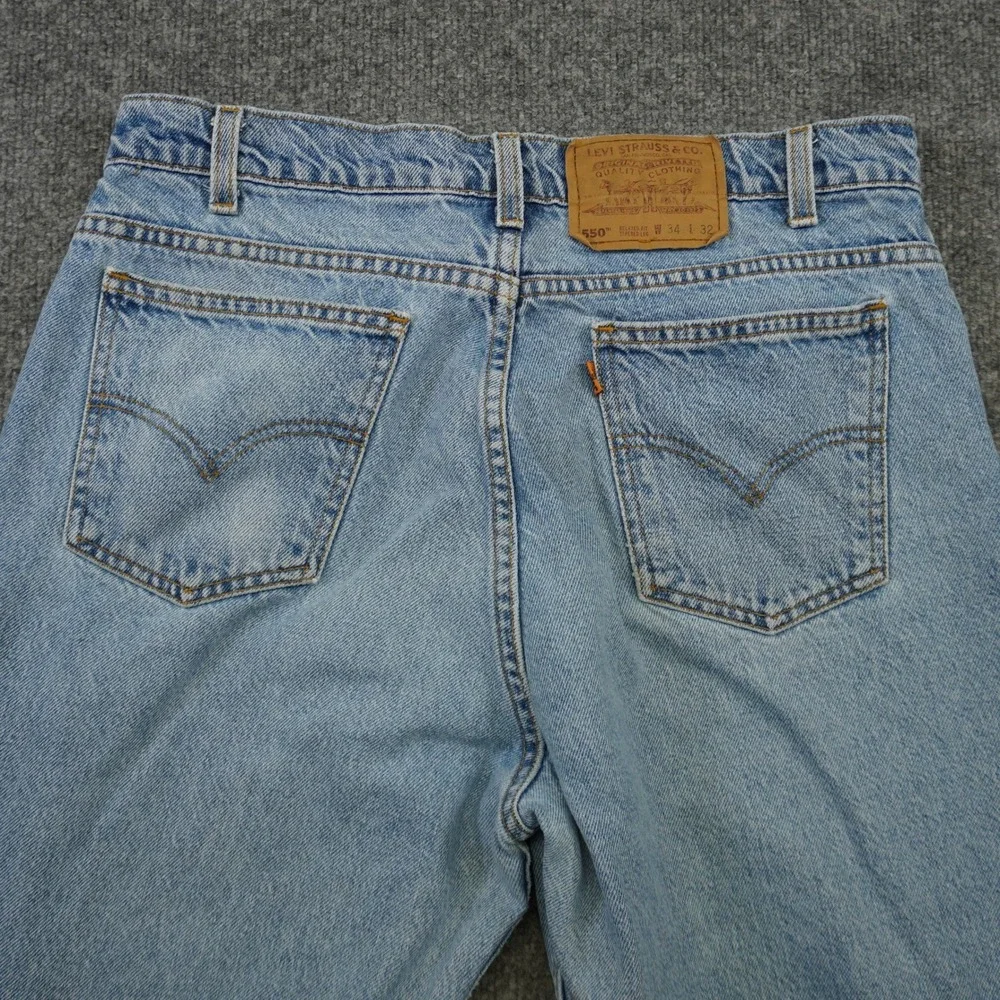 Vintage Levis 550 Relaxed Fit Tapered Mens Light Wash Orange Tab Jeans 34x32 90s